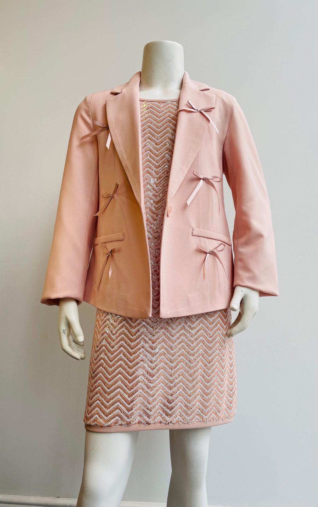Giacca elegante rosa cipria con fiocchi in raso
