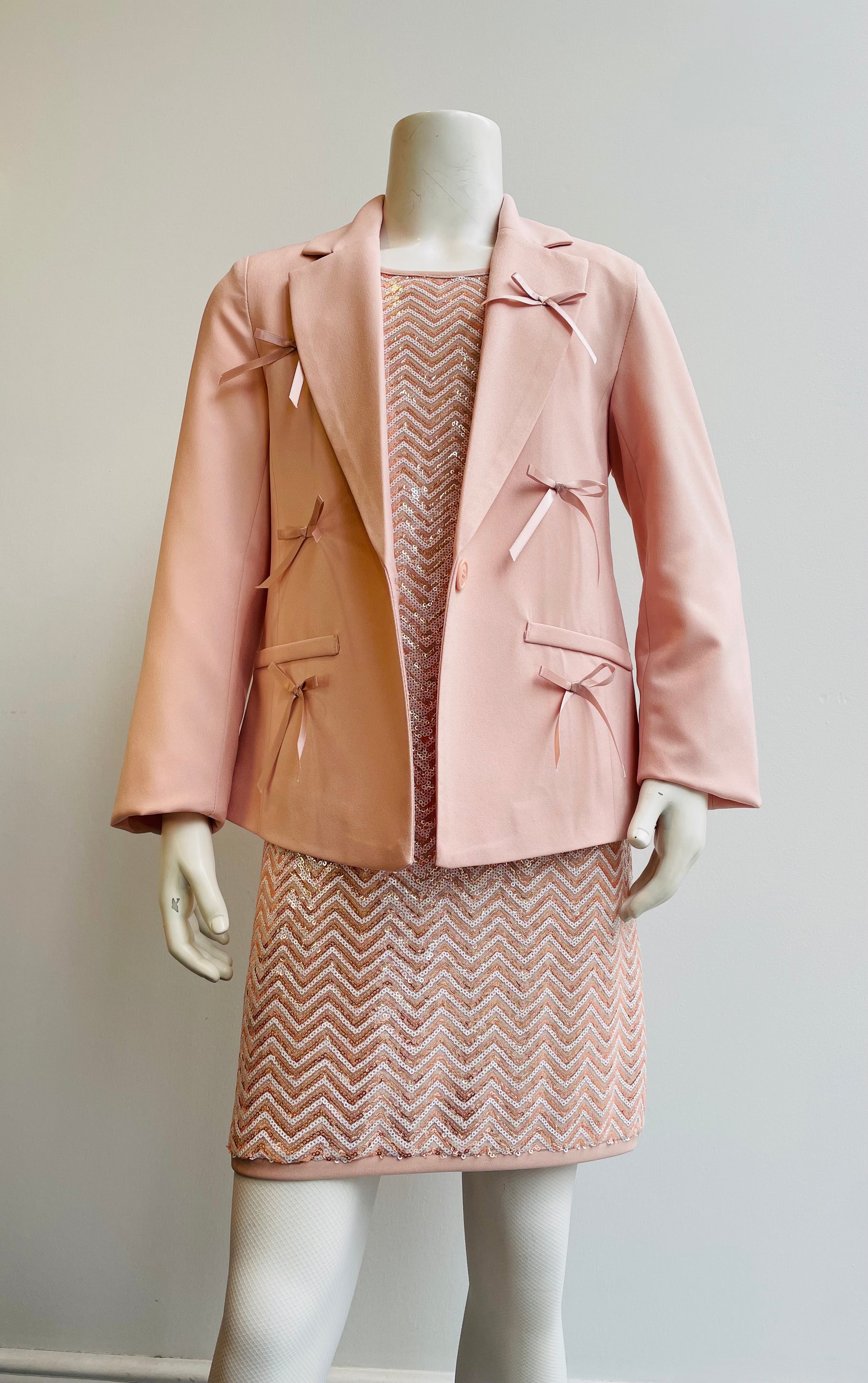 Giacca elegante rosa cipria con fiocchi in raso