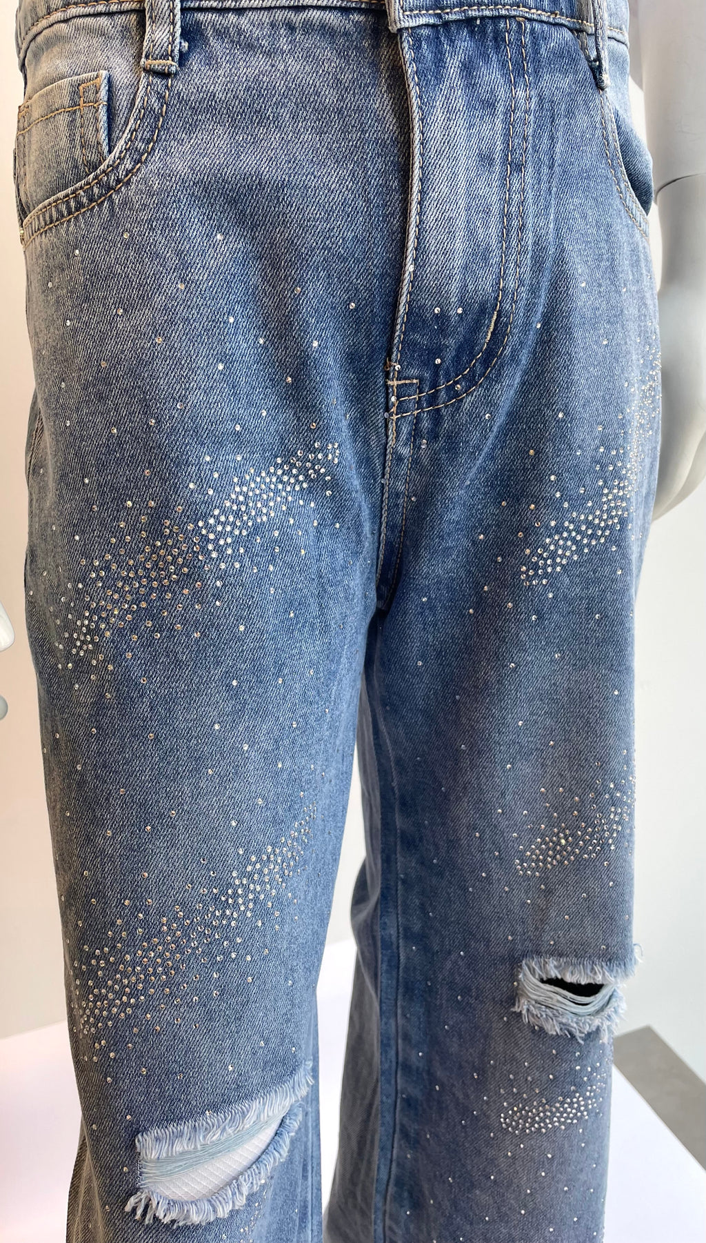 Jeans bambina con strappi e strass